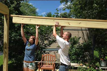 Carpenters framing a house